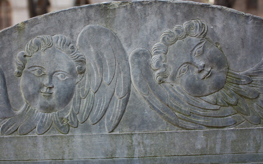 Cherubs grave marker detail