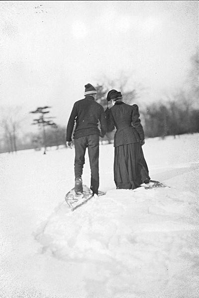Couple walking in snowshoes
